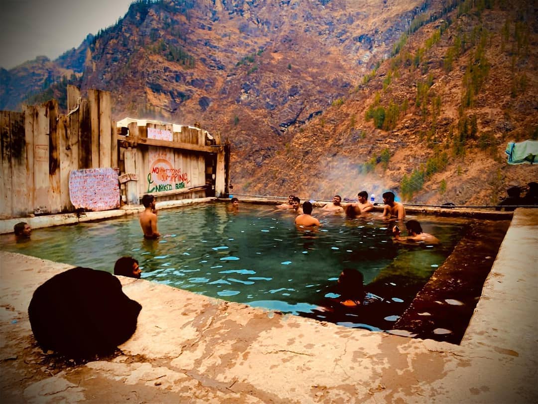 take a dip in the hot water springs